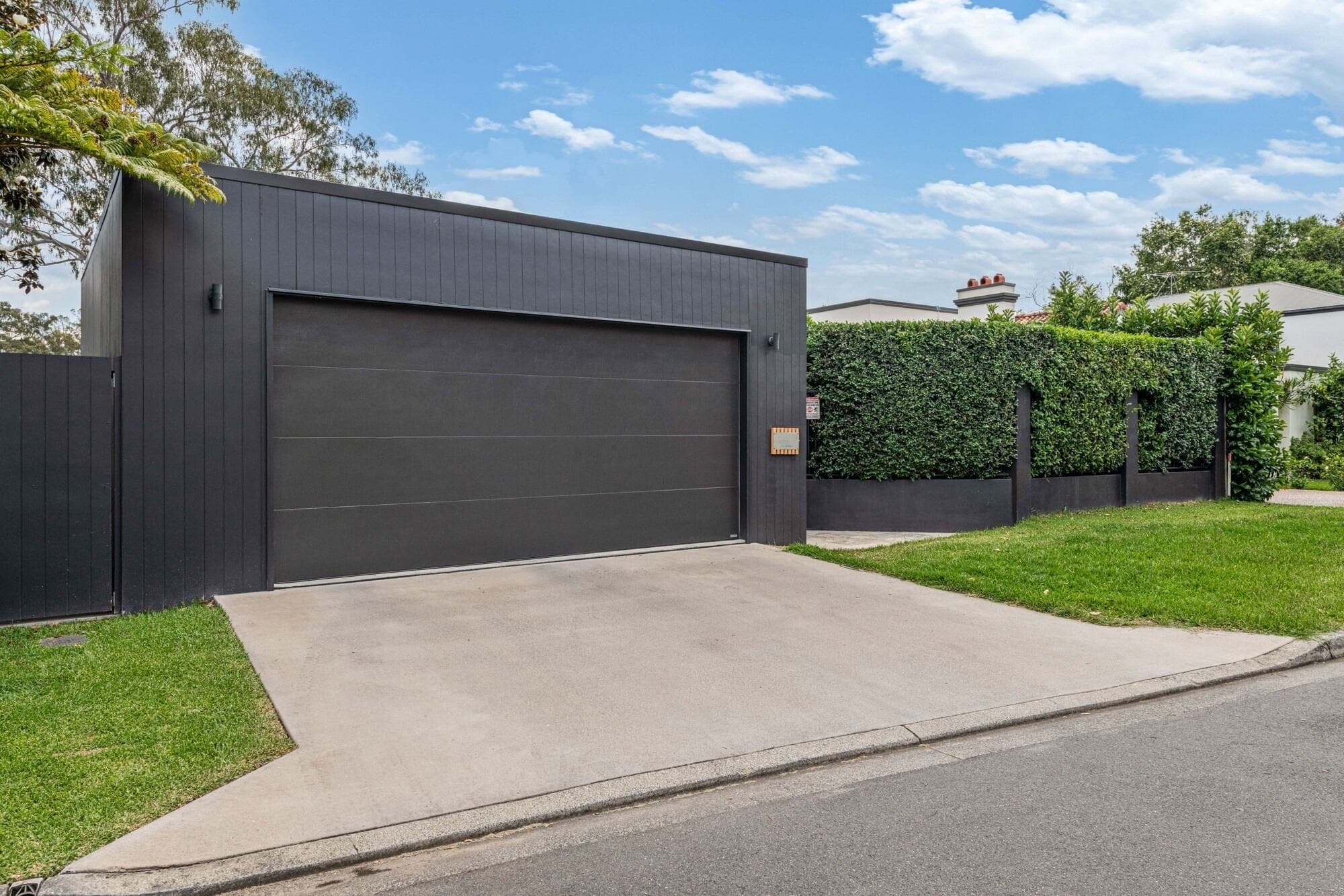 Charcoal sectional garage door running smoothly after repair