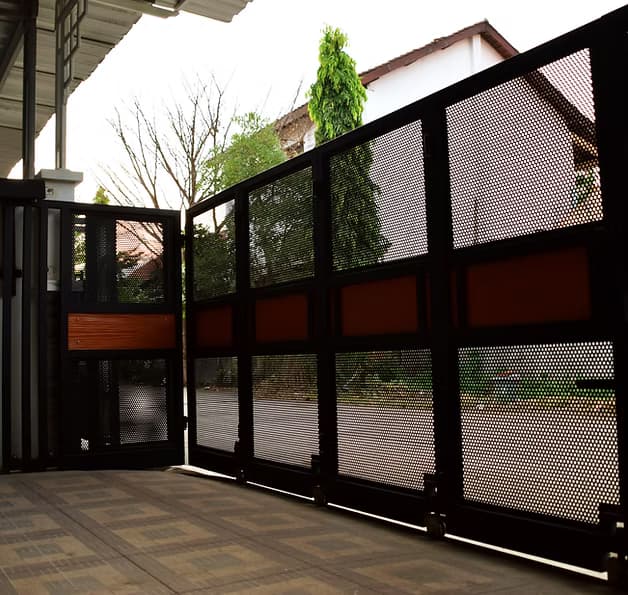 Automated sliding driveway gate on a track